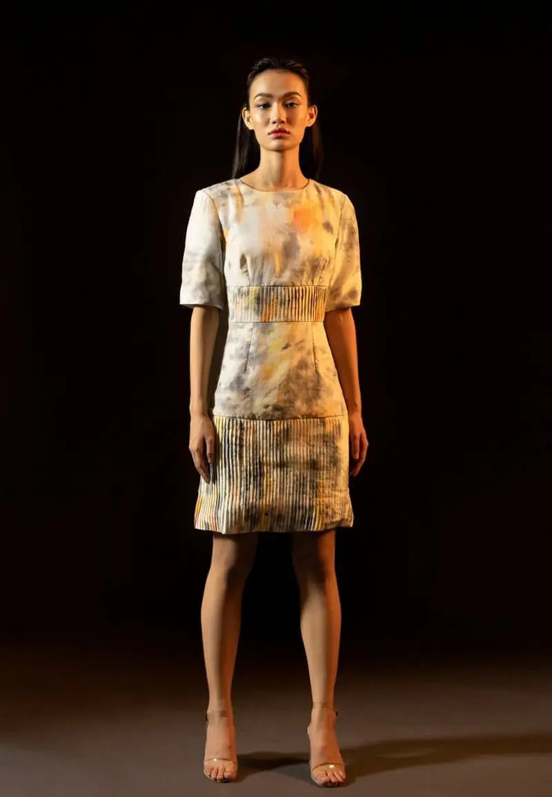Shoulder-padded pleated dress in yellow